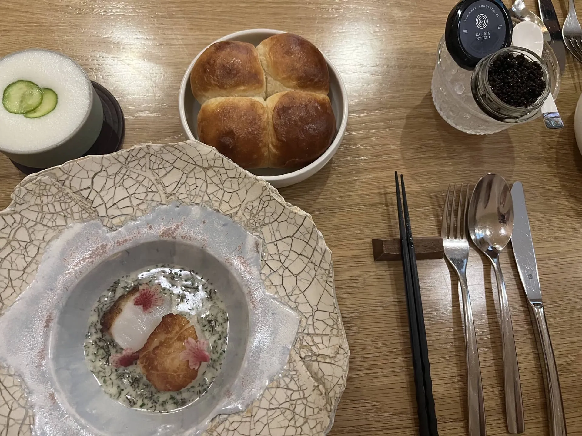 scallop, seaweed dashi butter sauce, ogo, radish, brioche